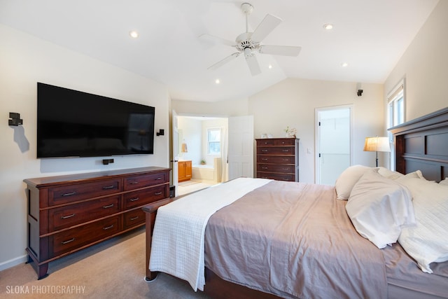 bedroom with recessed lighting, ensuite bath, vaulted ceiling, and light colored carpet