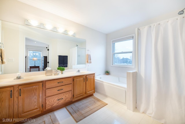 full bathroom with a garden tub, a sink, and double vanity