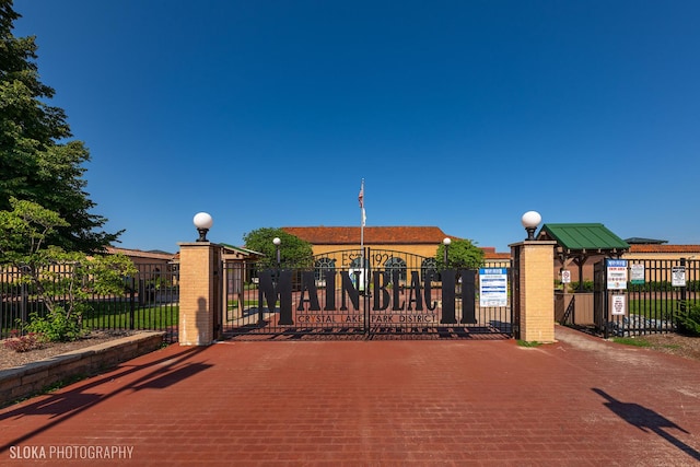 view of gate with fence