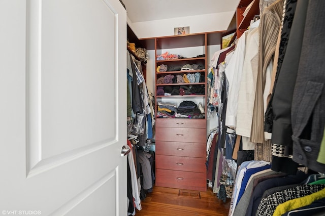 spacious closet with wood finished floors