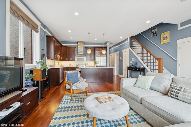 living area featuring stairway, dark wood-style flooring, and recessed lighting