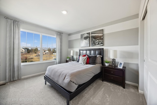 bedroom featuring baseboards and carpet floors