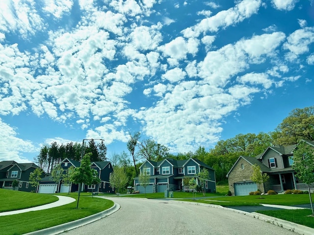 view of road featuring sidewalks, curbs, and a residential view