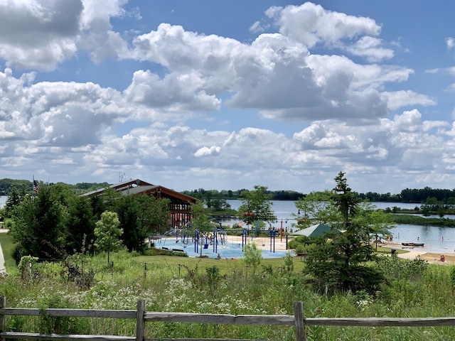 view of water feature with fence