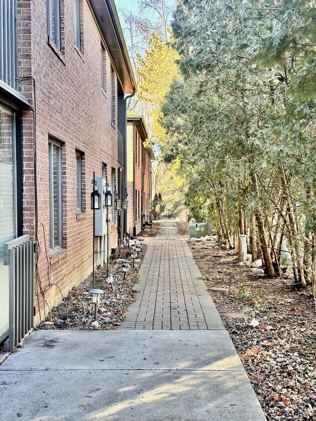 view of property exterior with brick siding