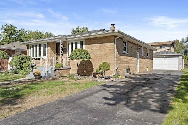 view of front of house featuring brick siding, a chimney, and an outdoor structure