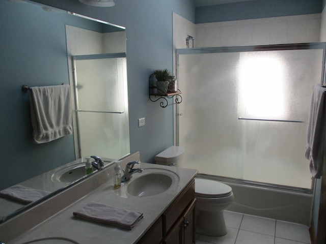 8032 Abbey Rd, Tinley Park, IL 60477 - full bath with tile patterned floors, double vanity, toilet, and shower / bath combination with glass door