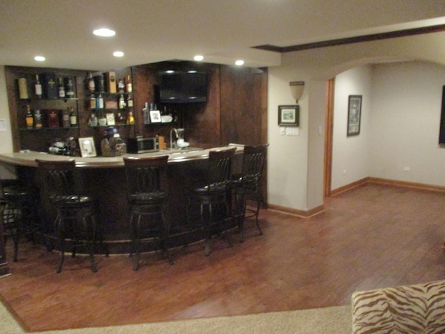8032 Abbey Rd, Tinley Park, IL 60477 - indoor wet bar featuring arched walkways, recessed lighting, wood finished floors, baseboards, and stainless steel microwave