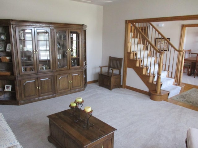 8032 Abbey Rd, Tinley Park, IL 60477 - living room featuring light carpet, stairs, and baseboards