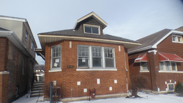 exterior space with brick siding