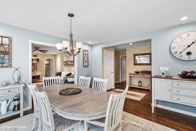 dining area with baseboards, a chandelier, wood finished floors, and recessed lighting