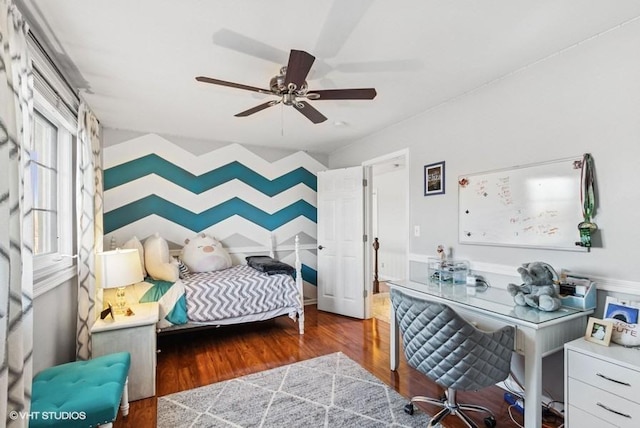 bedroom with ceiling fan and wood finished floors