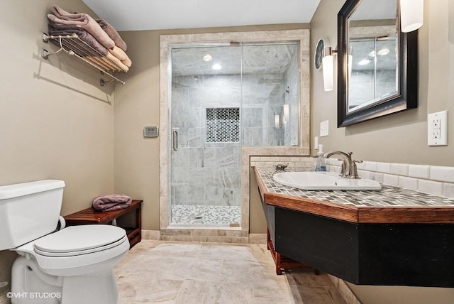 full bathroom featuring toilet, a shower stall, tile patterned flooring, and vanity