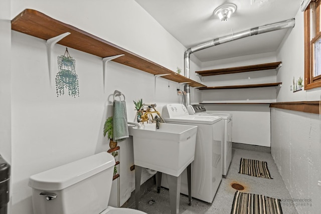 washroom featuring laundry area and washer and dryer