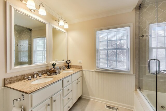 full bath with ornamental molding, a sink, visible vents, and tile patterned floors