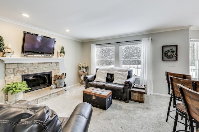 living room featuring a fireplace, carpet flooring, crown molding, and baseboards