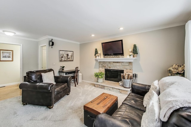 living room with ornamental molding, recessed lighting, a stone fireplace, and baseboards