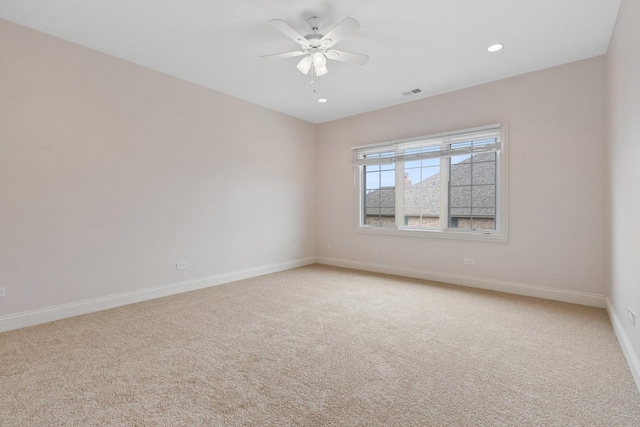 empty room featuring light carpet, baseboards, visible vents, ceiling fan, and recessed lighting