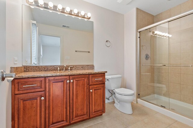 full bathroom with toilet, shower / tub combination, baseboards, and tile patterned flooring