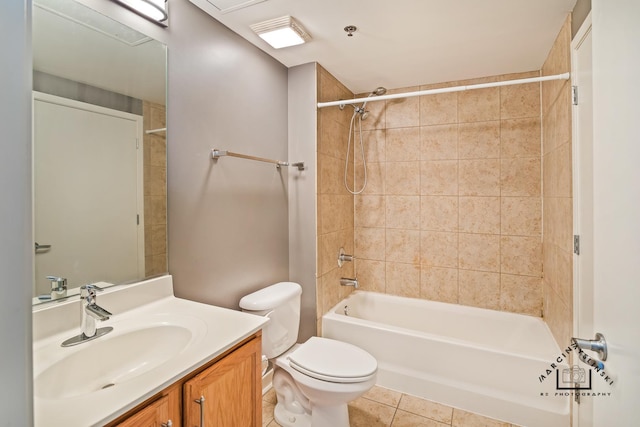 bathroom featuring toilet, bathing tub / shower combination, vanity, and tile patterned floors