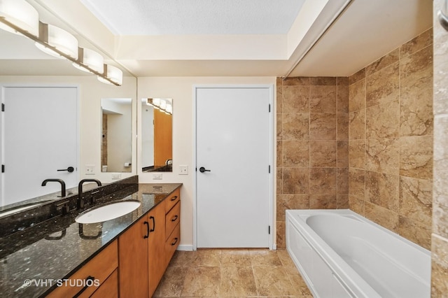 full bath featuring a bathtub, tile walls, and vanity