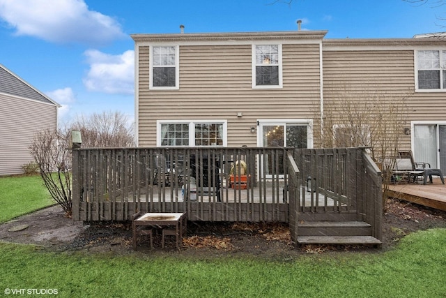 back of house featuring a wooden deck