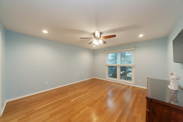 spare room with recessed lighting, baseboards, ceiling fan, and light wood finished floors