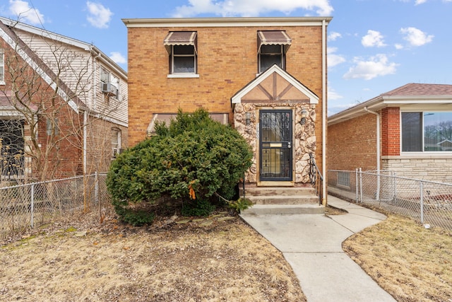 view of front of house with stone siding, brick siding, and fence