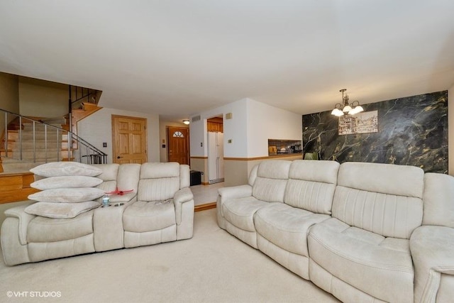 living area with stairs, carpet floors, a chandelier, and visible vents