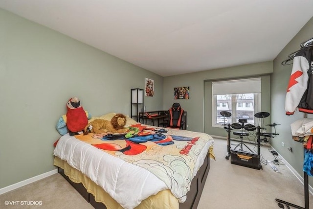 bedroom featuring carpet flooring and baseboards