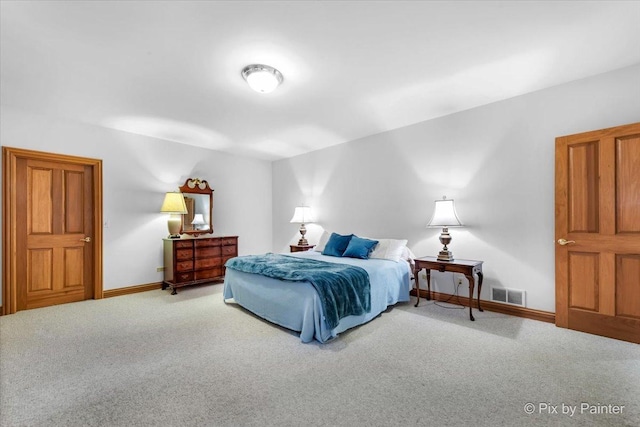 bedroom featuring carpet, visible vents, and baseboards