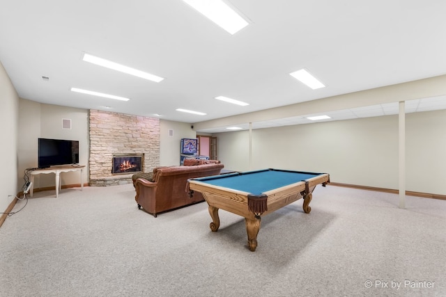 playroom with carpet floors, a stone fireplace, pool table, and baseboards