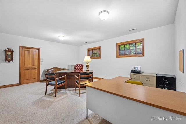 home office featuring carpet, visible vents, and baseboards