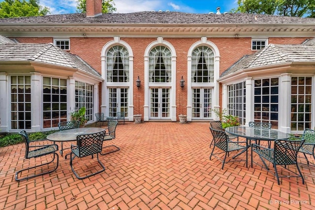 view of patio with outdoor dining space and french doors