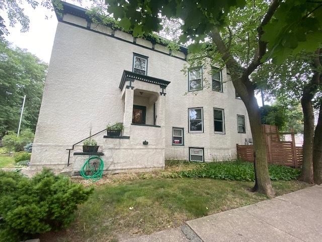 exterior space featuring fence and stucco siding