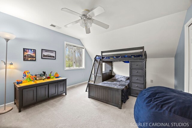 bedroom with lofted ceiling, light carpet, baseboards, and visible vents