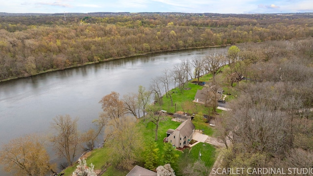 aerial view with a forest view and a water view