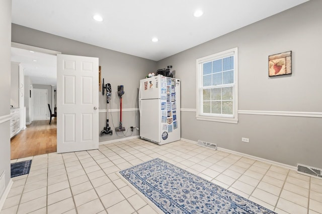 interior space featuring light tile patterned flooring, visible vents, and recessed lighting