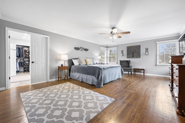 bedroom with ceiling fan, ornamental molding, wood finished floors, and baseboards