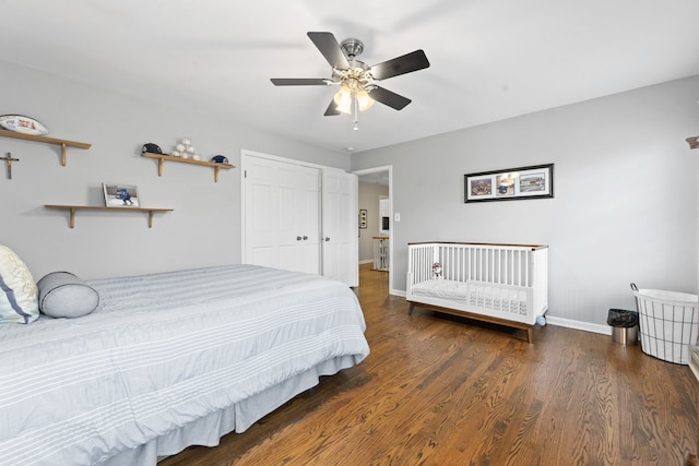 bedroom with ceiling fan, a closet, baseboards, and wood finished floors