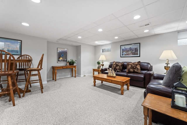 carpeted living room with a paneled ceiling, recessed lighting, visible vents, and baseboards