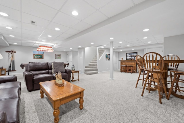 living area with light carpet, baseboards, stairway, a bar, and recessed lighting