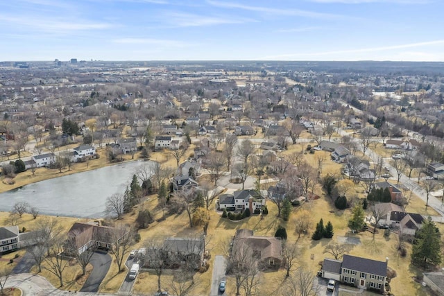 drone / aerial view featuring a residential view and a water view