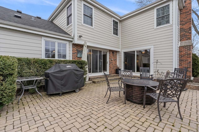 view of patio featuring a fire pit and grilling area