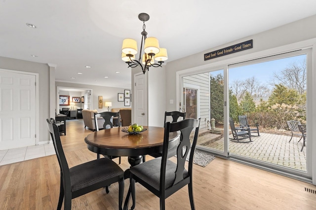 dining room with light wood-style floors, visible vents, a chandelier, and recessed lighting