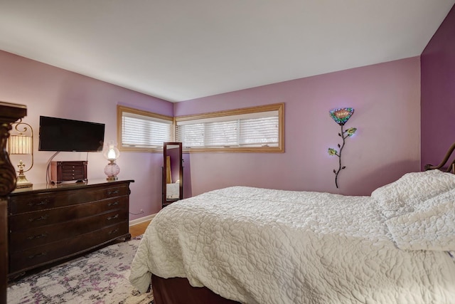 bedroom featuring baseboards