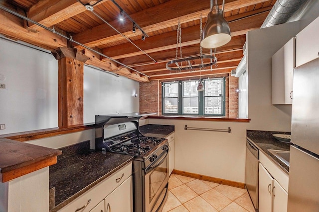 kitchen with light tile patterned floors, stainless steel appliances, wood ceiling, baseboards, and rail lighting