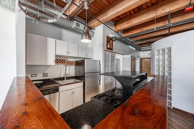 kitchen with visible vents, appliances with stainless steel finishes, white cabinets, and a sink