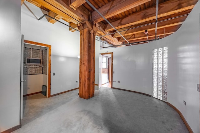 basement featuring carpet floors and baseboards