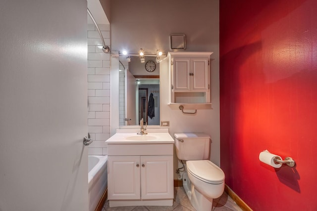 full bath featuring shower / washtub combination, toilet, vanity, baseboards, and tile patterned floors